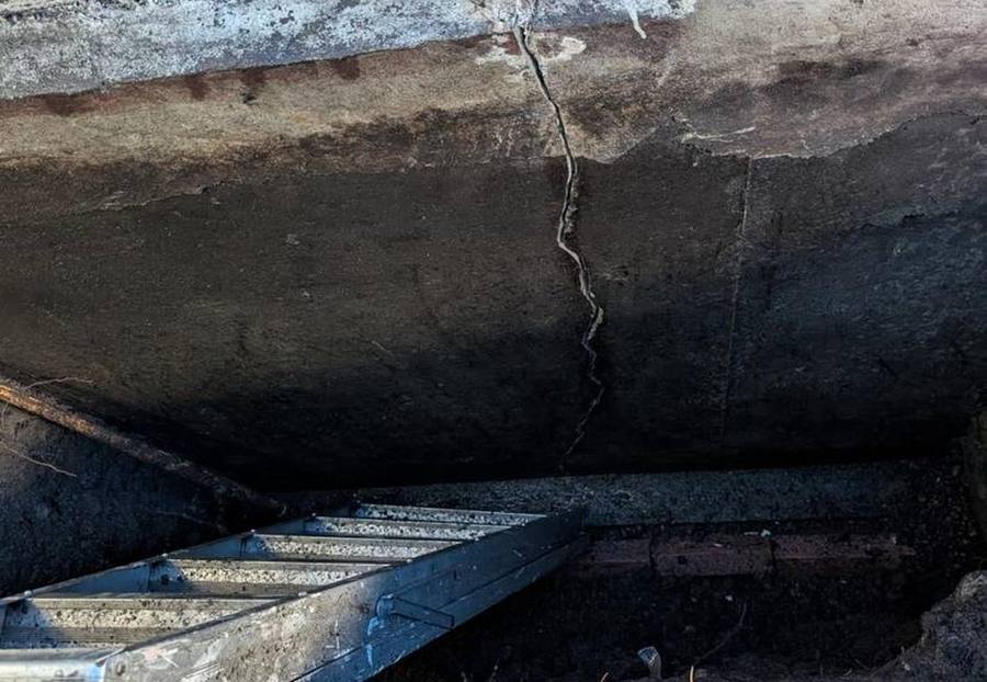Foundation crack below a basement window before repair