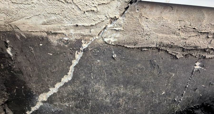 Foundation crack sealed with flexible injection material