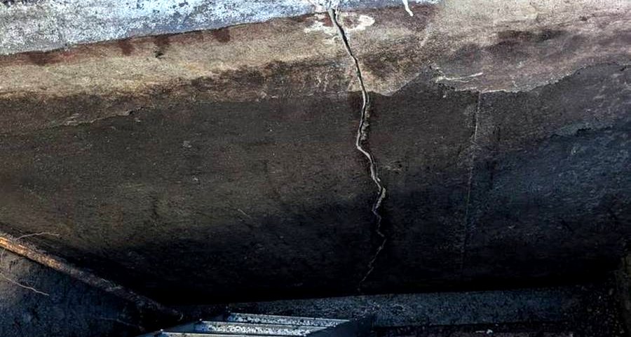 Vertical structural crack in an Edmonton foundation wall exposed by excavation